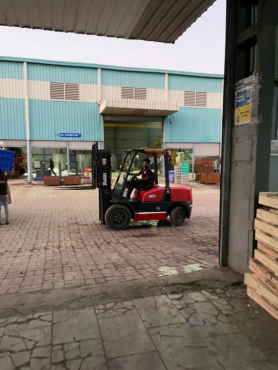 Workers coordinating heat treatment and forging schedules.